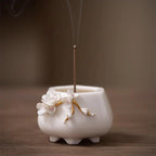 Hand-sculpted floral white porcelain aroma burner and creative ceramic incense stick holder