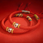 Buddhist prayer beads red string