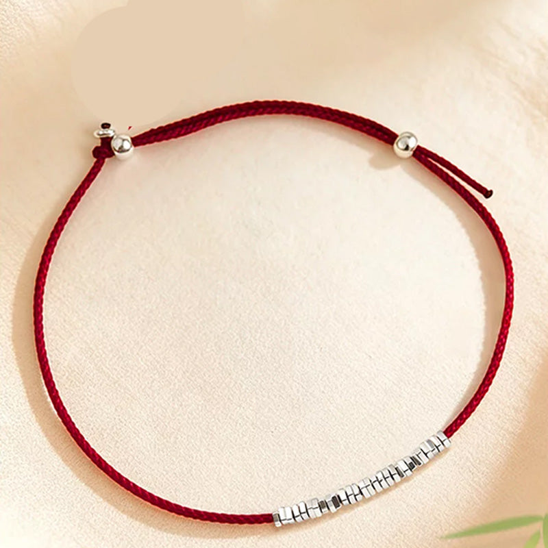 Small silver nugget and red cord anklet