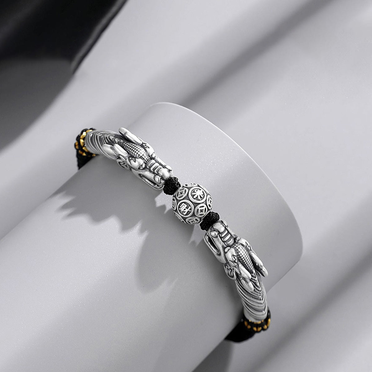 Black cord featuring two dragons playing with a pearl