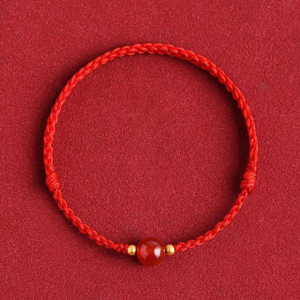 Red string bracelet with love beans