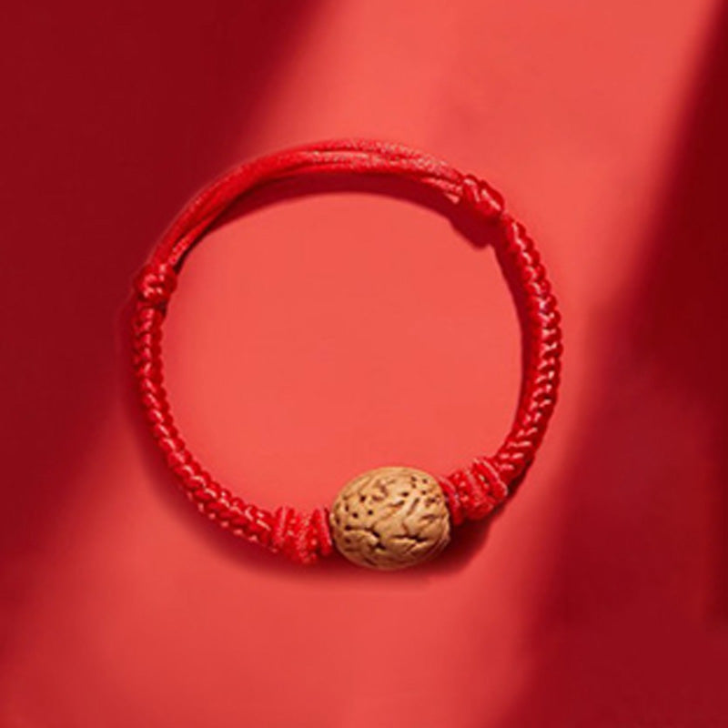 Peach wood red rope