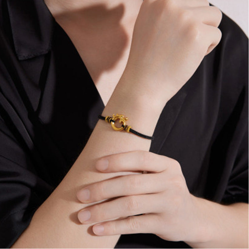 Gold bracelet with dragon motif