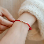 Red cord bracelet with large "broken silver" beads