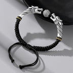 Black cord featuring two dragons playing with a pearl