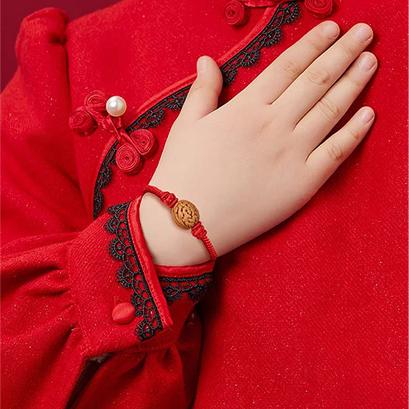 Peach wood red rope